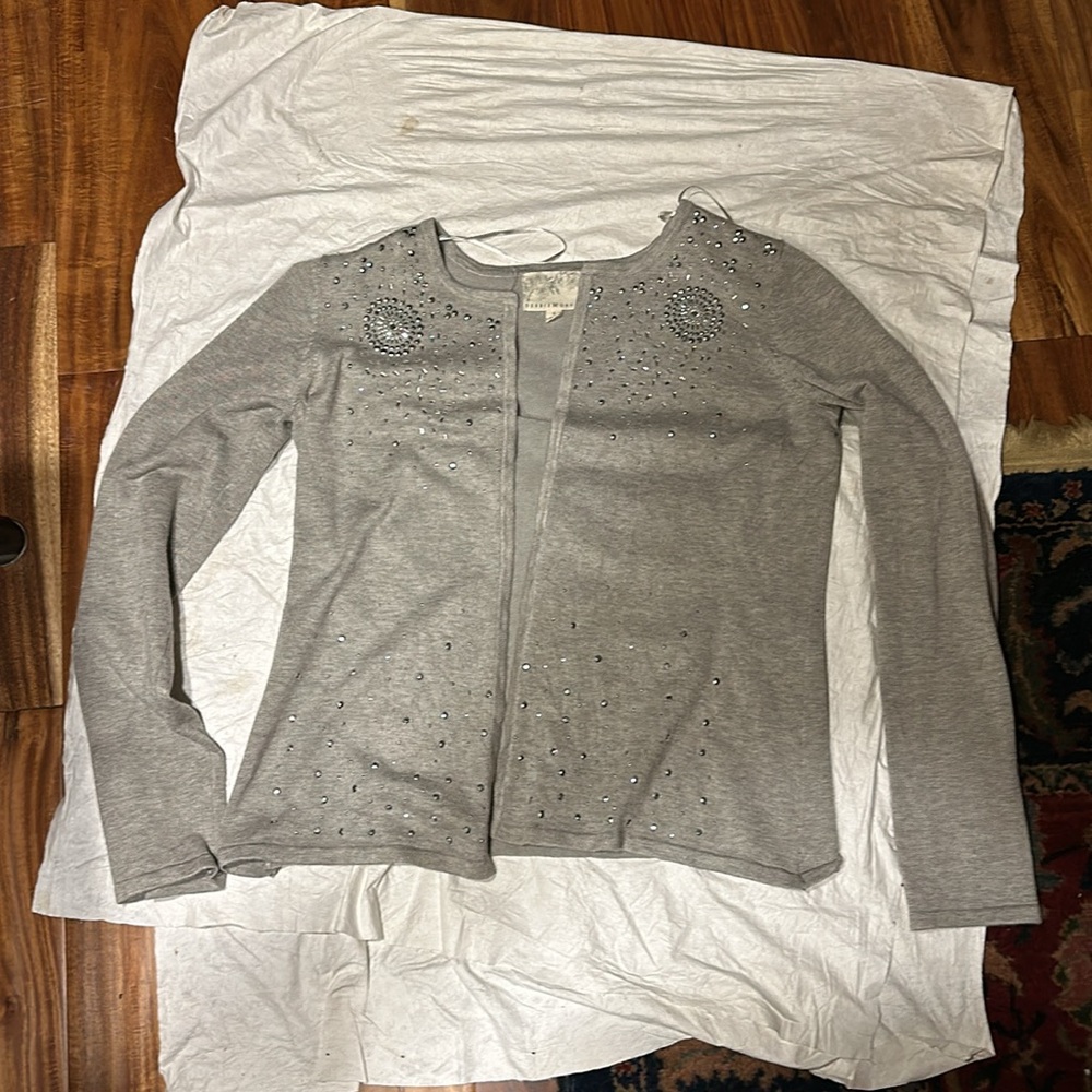 Soft sweater with sequins. Rayon and polyester. Looks like it’s never been worn.